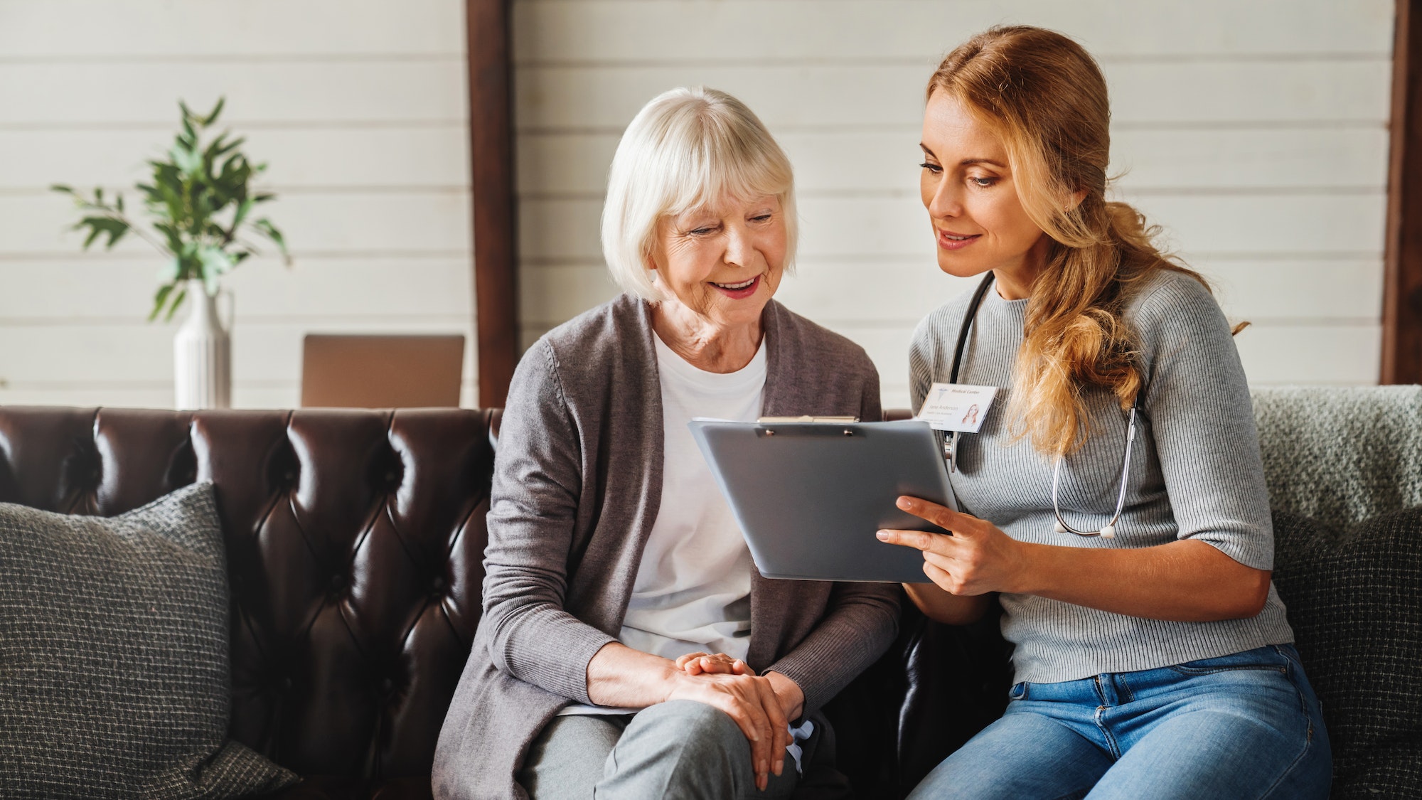 front-view-shot-of-caring-young-woman-nurse-help-old-granny-during-homecare-medical-visit.jpg