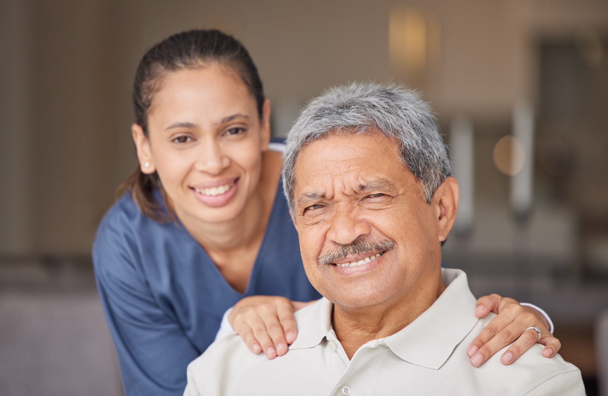 portrait-of-elderly-man-with-a-nurse-bonding-during-a-checkup-at-assisted-living-homecare-smile-.jpg